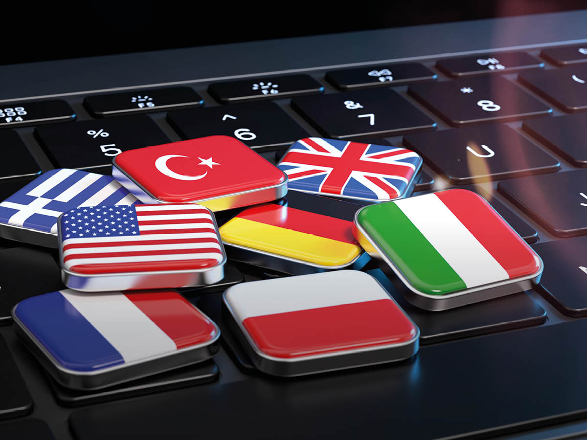 Viereckige Buttons mit verschiedenen Länderflaggen als Symbol für Sprachen, Übersetzung und internationale Kommunikation.